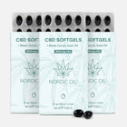 Tre CBD-softgel-pakker med cannabisblad-mønster og Nordic Oil-logo, blisterpakker med sorte kapsler
