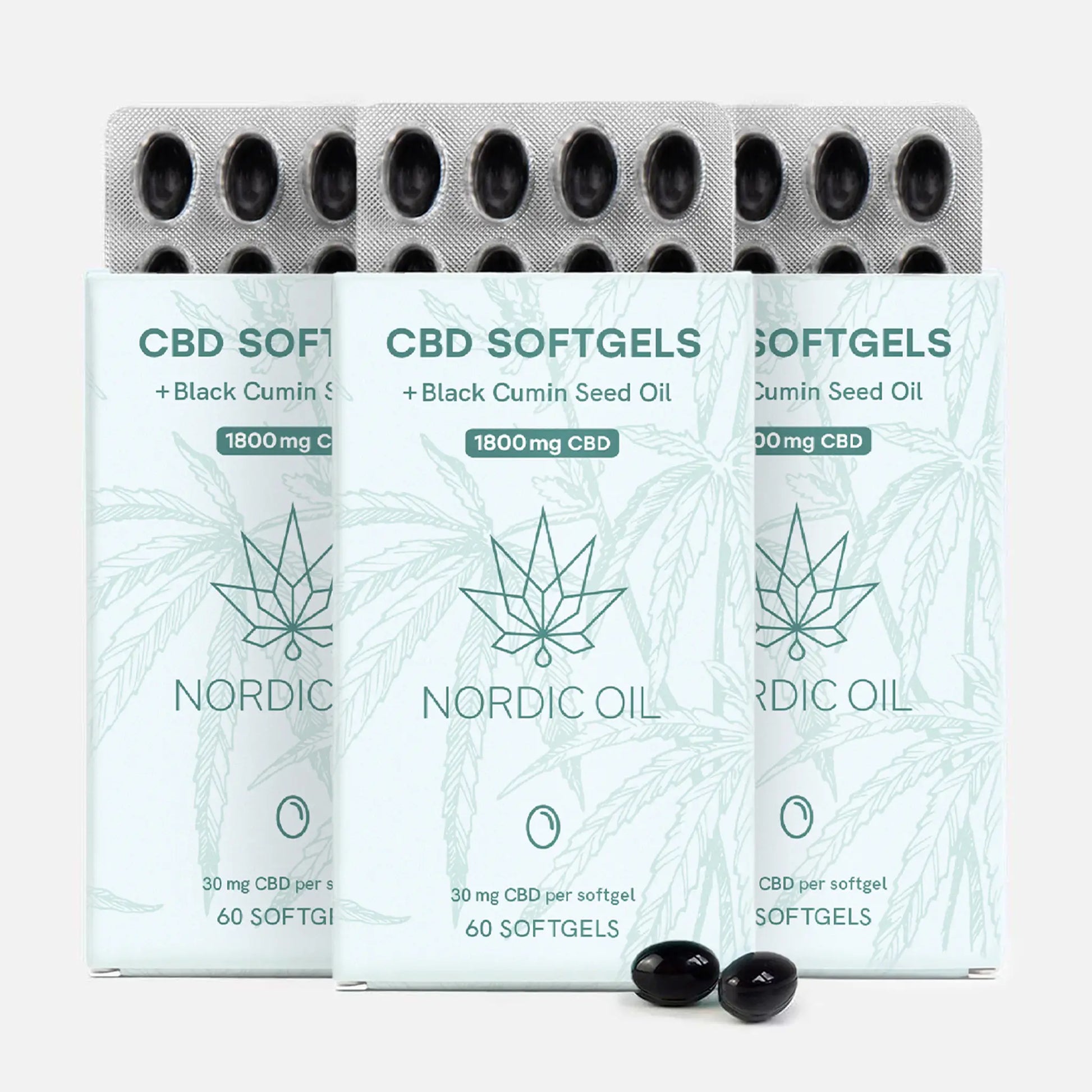 Tre CBD-softgel-pakker med cannabisblad-mønster og Nordic Oil-logo, blisterpakker med sorte kapsler