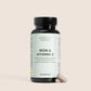 Nordic Oil Essentials jern og C-vitamin-kapsler i flaske med to kapsler ved siden af