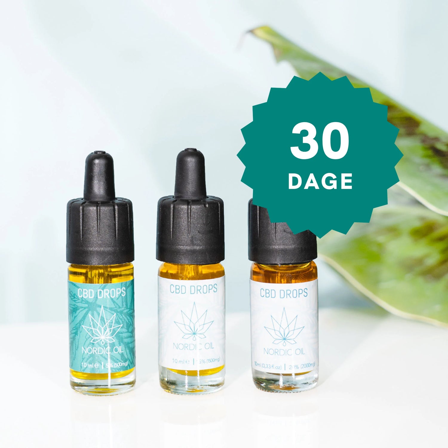 Tre CBD-dråber-flasker fra Nordic Oil med droppere og et grønt badge med teksten 30 DAGE.