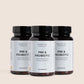 Tre mørkebrune glasflasker med sorte låg og etiketter Nordic Oil Essentials PRE & PROBIOTIC.
