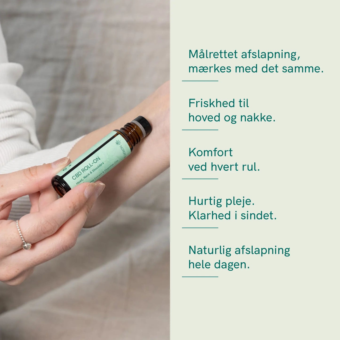 Nærbillede af en hånd, der holder en CBD-roll-on-flaske ved armen.