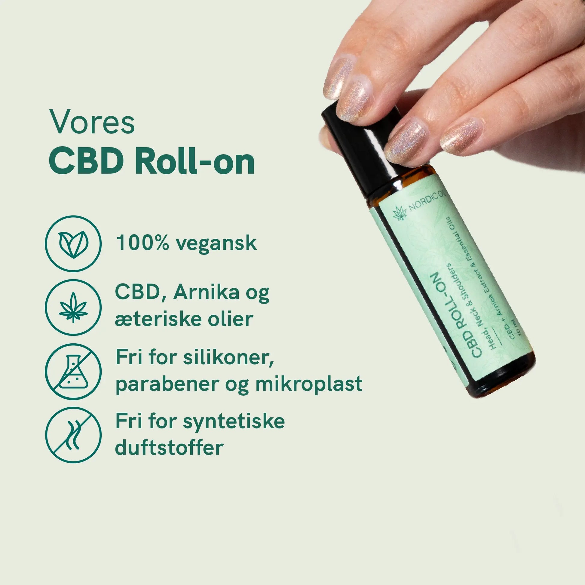 CBD Roll-on fra Nordic Oil med grøn etikette; hånd der holder flasken ved siden af teksten: 100% vegansk, CBD, arnika og æteriske olier, fri for silikon, parabener og mikroplast samt syntetiske duftstoffer.