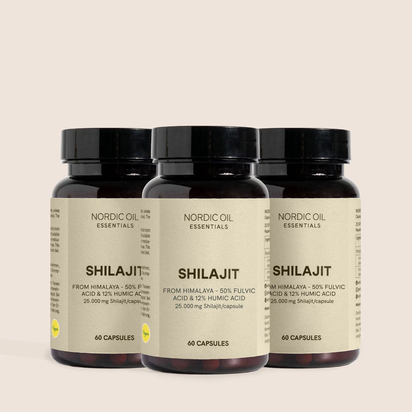 Tre mørkebrune glasflasker med Shilajit-kapsler fra Nordic Oil Essentials