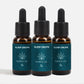Tre brune glasflasker med pipette og blå etiketter mærket Sleep Drops fra Nordic Oil