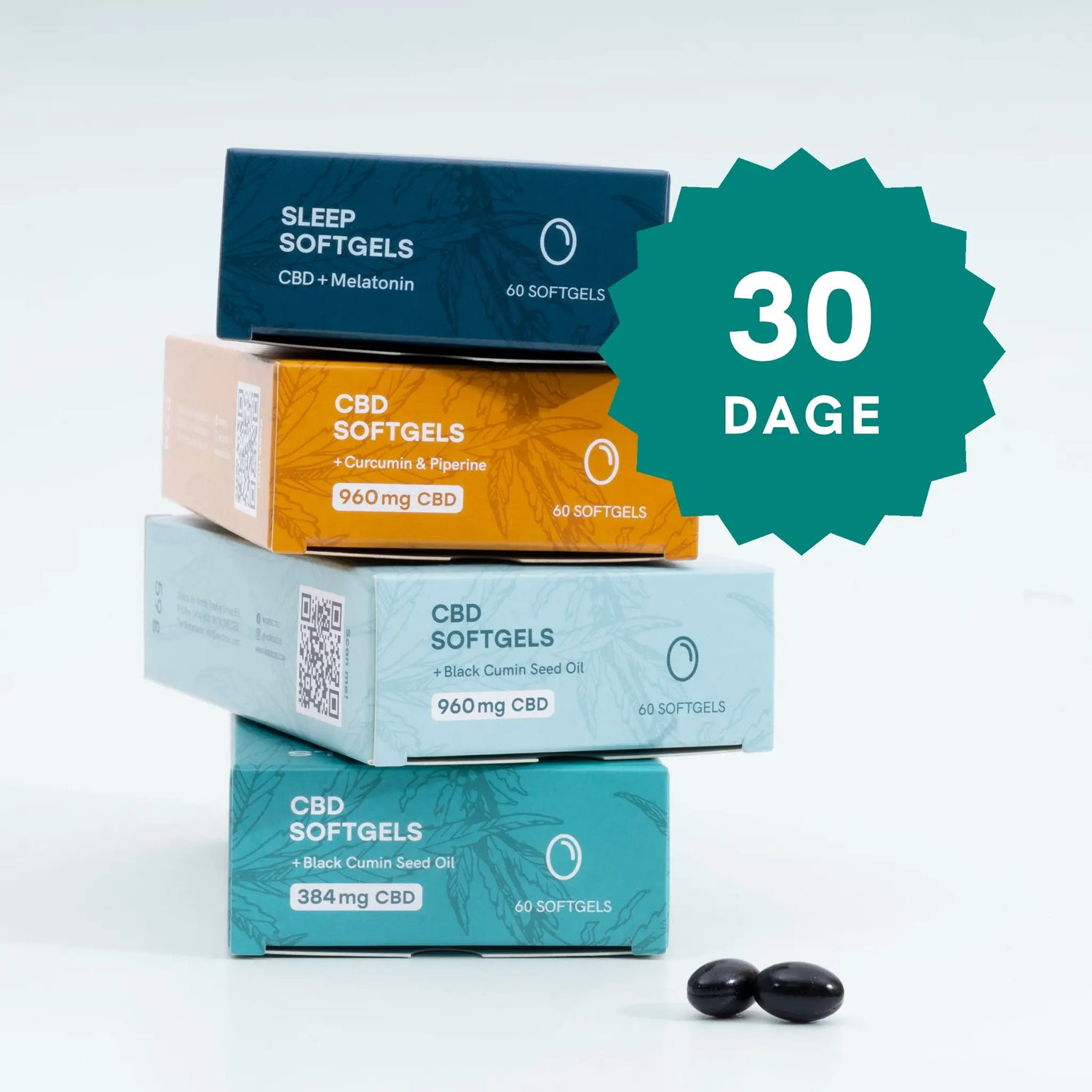 CBD-softgels i farvede æsker stablet i en stak med et stort 30-dages badge og to sorte softgels i forgrunden
